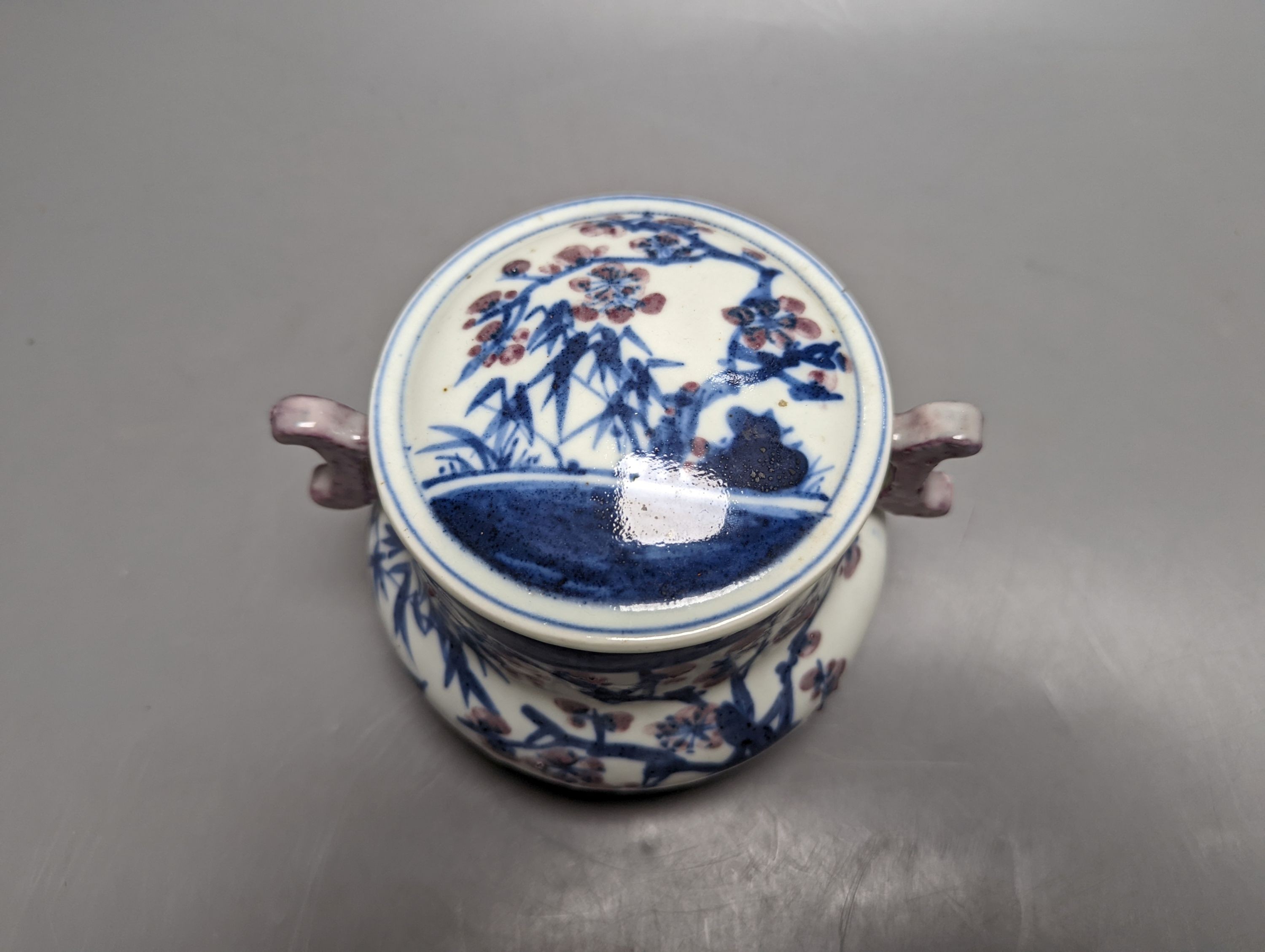 A Chinese underglaze blue and copper red jar and cover, Xuande six character mark but later 12cm